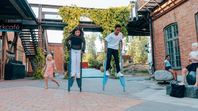 Children walking on stilts