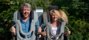 Dad and kid in Robocoaster
