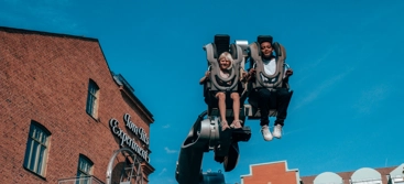 Two kids in Robocoaster